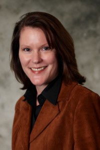 Joan E. Herbig.