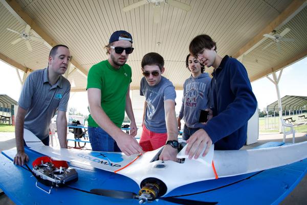 Students inspecting an aircraft