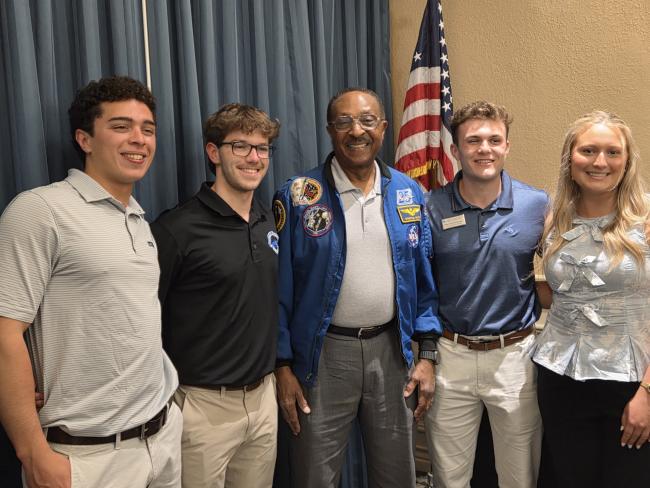 L to R: Nico Ramirez, mechanical engineering junior, Henry Clan, mechanical engineering junior, Winston Scott, Ret. U.S. Navy Captain and astronaut, Harrison DeLaney, mechanical engineering junior and  Ruthie Houston,&nbsp;computer science junior. 