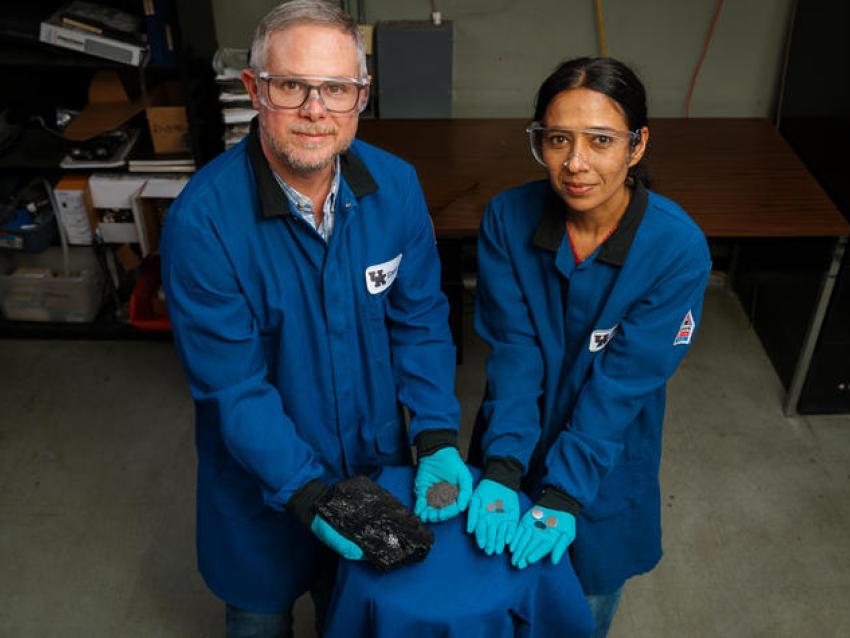 Matt Weisenberger and Aman Preet Kaur hold the progression of coal, from raw resource to finished battery.
