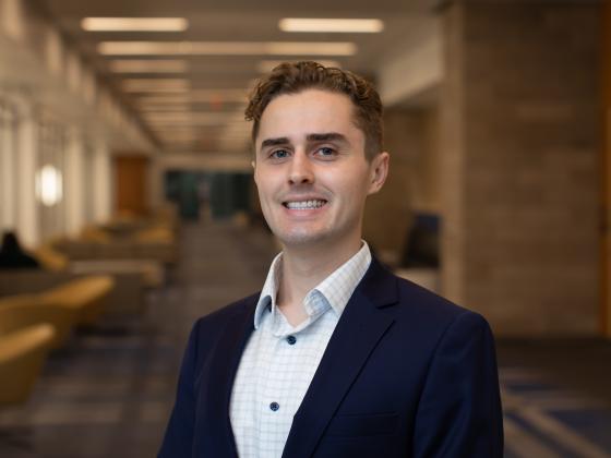 Professional headshot of Daniel Dailey.