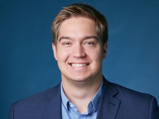Professional headshot of Rollie Mills.