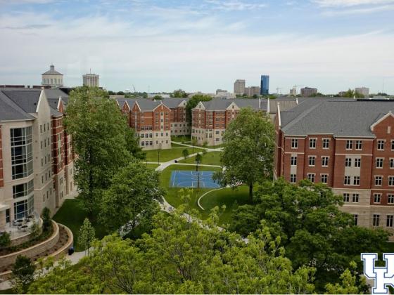 Overhead view of dorms on campus with a basketball court in the middle.