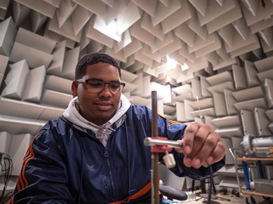 Student working in an anechoic chamber.